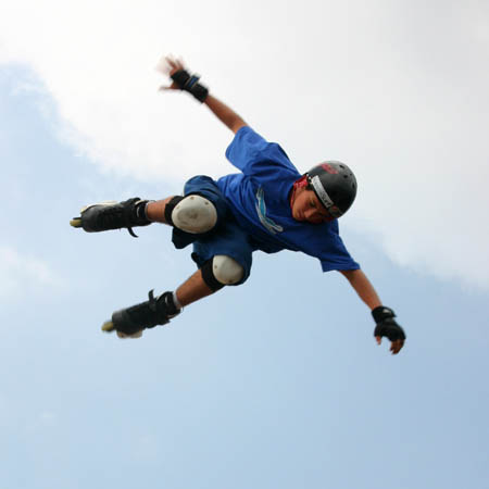 A Skater flying through the air performing a stunt