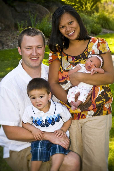 Traditional picture of a family portrait with two parents and two children