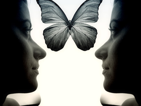 A Profile Pose Of Both Sides Of A Woman's Face With A Butterfly In Between